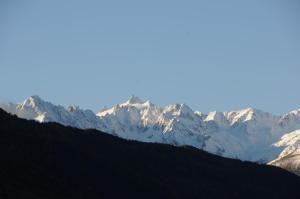 a snow covered mountain range in the distance at Chambre chez l'habitant in Saxon +6 photos