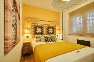 Postel nebo postele na pokoji v ubytování El Samburu - Apartamento Premium inspirado en África - Grupo Querbes