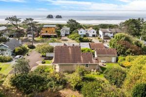 an aerial view of a houses and the ocean at Twin Rocks Hideaway in Rockaway Beach
