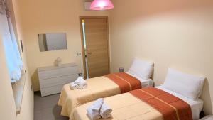 Postel nebo postele na pokoji v ubytování La Casa degli Angeli