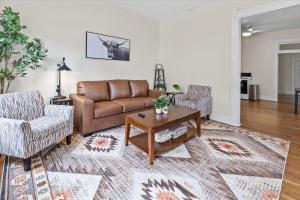 a living room with a couch and a coffee table at Simple Comfort 1 Bed 1 Bath Near Downtown Indy in Indianapolis