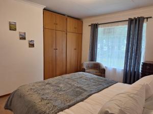 Postel nebo postele na pokoji v ubytování Guesthouse at Lucia