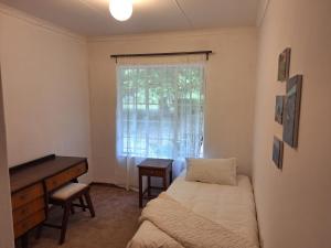 Postel nebo postele na pokoji v ubytování Guesthouse at Lucia + 10 fotografií