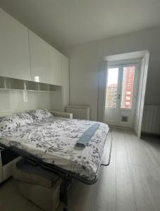 Ένα ή περισσότερα κρεβάτια σε δωμάτιο στο muratori prime