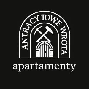 a logo for an ancient arch with a window and an arrow at Apartament Antracytowe Wrota 2 in Boguszów-Gorce +2 photos