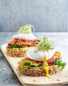 two sandwiches with eggs on top on a cutting board at Mambo Villa in Matemwe +52 photos