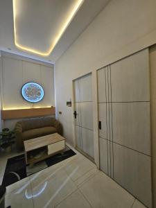 a living room with a couch and a table at Villa paradise 360 pantai prigi in Tasikmadu