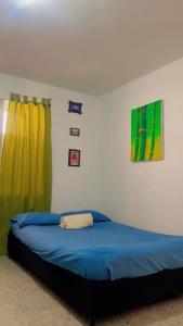 Ένα ή περισσότερα κρεβάτια σε δωμάτιο στο Hostal Abba