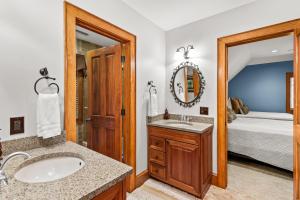 a bathroom with a sink and a mirror at Creekside Hideaway at The Farm in Banner Elk +44 photos