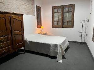 Ένα ή περισσότερα κρεβάτια σε δωμάτιο στο Apart Santa Ana de los Indios Guácaras +15 φωτογραφίες