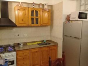 Η κουζίνα ή μικρή κουζίνα στο Triplex Oro San Bernardo +4 φωτογραφίες