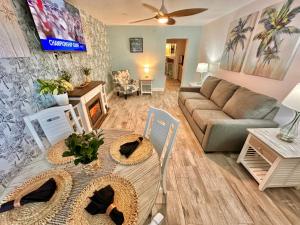 a living room with a couch and a table at Malibu Resort Motel in St Pete Beach