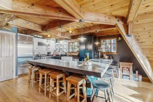 a large kitchen with a large table and chairs at Serene Lakes Splendor in Soda Springs +28 photos