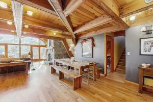a dining room with wooden ceilings and a table at Serene Lakes Splendor in Soda Springs