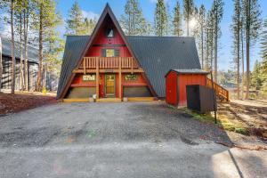 a red house with a gambrel roof at Serene Lakes Splendor in Soda Springs