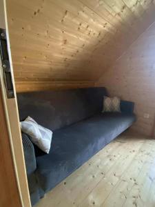 a couch in a tiny house at Sister's House Zator in Zator +36 photos