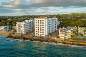 an aerial view of buildings on the beach at Beachfront Serene Apt at Victoria del Mar 3F in Stella