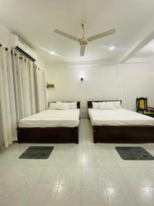 Postel nebo postele na pokoji v ubytování Seavora Tangalle