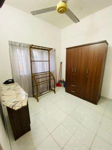 a room with a bed and a wooden cabinet at Seavora Tangalle in Tangalle +17 photos