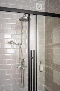 a shower with a glass door in a bathroom at Delabere House - Luxury Cotswolds Holiday Apartments in Moreton in Marsh +37 photos