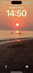 a picture of a sunset on the beach at Sea view in Shëngjin
