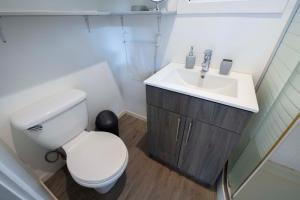 a bathroom with a white toilet and a sink at Casa Playa Avellanas in Playa Avellana