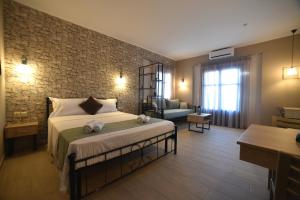 Postel nebo postele na pokoji v ubytování Shining Star Petra