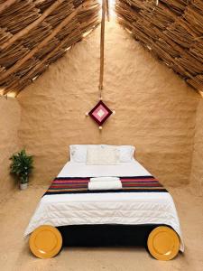 Postel nebo postele na pokoji v ubytování rancheria divi divi