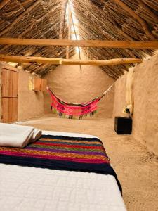 Postel nebo postele na pokoji v ubytování rancheria divi divi