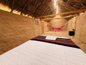 Postel nebo postele na pokoji v ubytování rancheria divi divi