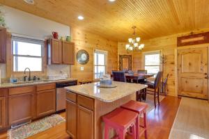 a kitchen and dining room with a table and chairs at Decks and Panoramic Views Rustic Sparta Cabin in Sparta