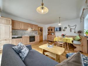 a living room with a couch and a table at Blumenhof in Dietersdorf +45 photos