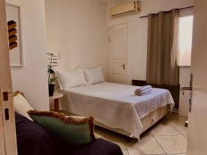 Ένα ή περισσότερα κρεβάτια σε δωμάτιο στο CeoHost Studios Premium