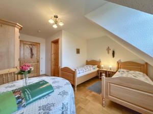 a bedroom with two beds in a room at Blumenhof in Dietersdorf