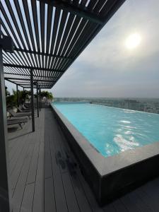 a swimming pool on top of a building at Bloom Styled Studio at The Lennox in Accra