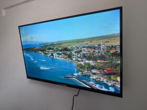 a flat screen tv hanging on a wall at Kyiv Sky Apartment in Kyiv