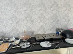 a kitchen counter with a stove top with a bowl of food at Hotel Moon in Samarkand +15 photos