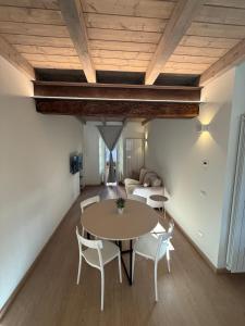 a room with a table and chairs and a couch at Casa Iside in Cannobio
