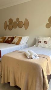 two beds with towels on top of them in a room at Pousada Vista Encantada Preá in Cruz +40 photos