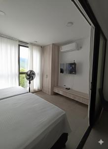 Ένα ή περισσότερα κρεβάτια σε δωμάτιο στο Apartamento Moderno a Estrenar con Excelente Ubicación Santa Marta