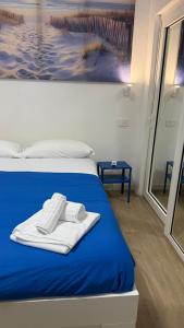Postel nebo postele na pokoji v ubytování Blu Mediterraneo