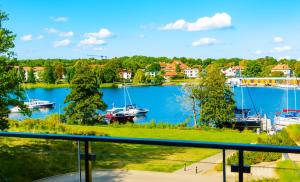 a view of a marina with boats in the water at Perfect View II - idealny widok na Marinę in Iława