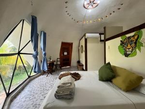 Postel nebo postele na pokoji v ubytování Cayuco Maya