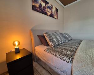 Ένα ή περισσότερα κρεβάτια σε δωμάτιο στο Apartman Veki +14 φωτογραφίες