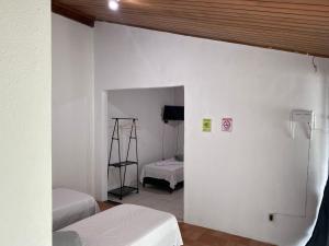 Postel nebo postele na pokoji v ubytování Pousada Sagrada Devoção