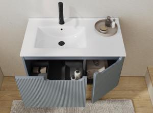a bathroom sink with a white counter top at ClaMar Apart Hotel in Porto Ercole