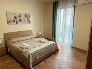 Postel nebo postele na pokoji v ubytování Casa D'Amuri