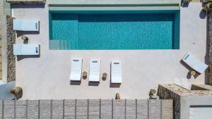 an overhead view of a swimming pool on a house at Villa Lazuli - Golden Beach in Márpissa