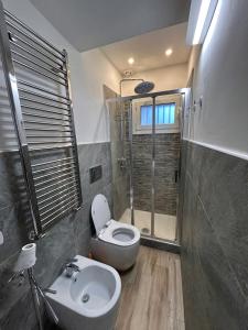a bathroom with a toilet and a sink and a shower at Casa Cristina2 in Grottaferrata