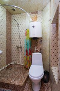 a small bathroom with a toilet and a shower at 1 bedroom Modern, Sunny apartment in Amiryan street AM104 in Yerevan +19 photos